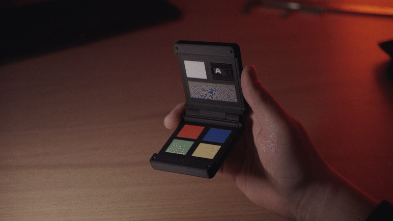 Kōlor in someone's hand. The person is closing the Kōlor pretty fast, using it as a cinema clap.